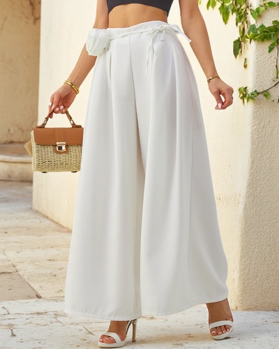 Royalfashion Elegantní široké dámské kalhoty s dekorační květinou u pásku