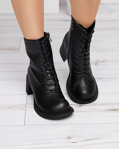 Dámské černé kozačky s kotníčkovými botami na sloupku Caretti. Obuv