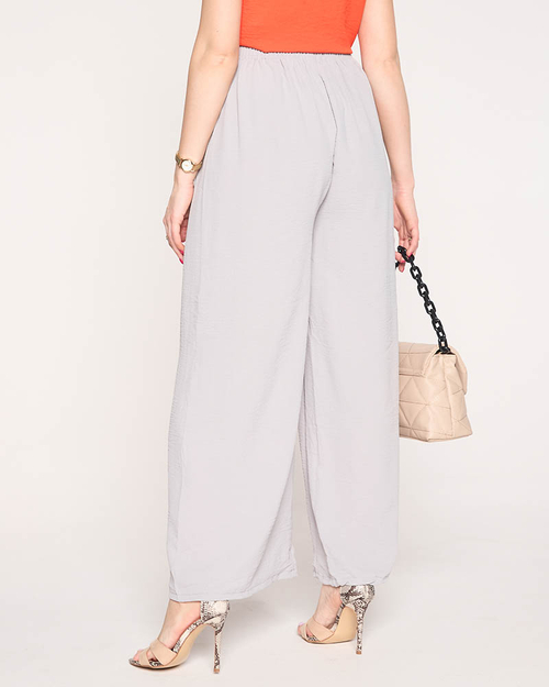 Жіночі широкі штани палаццо світло-сірого кольору - Одяг