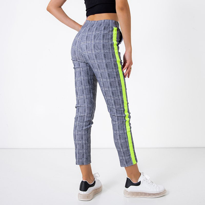 Сірі штани в клітинку з неоновими жовтими лампасами