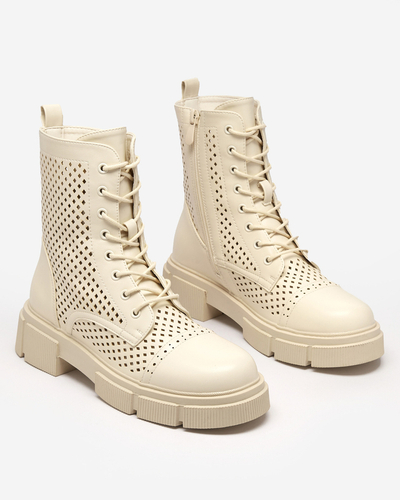 Prolamované béžové dámské kozačky na plochých podpatcích Rolika - Footwear
