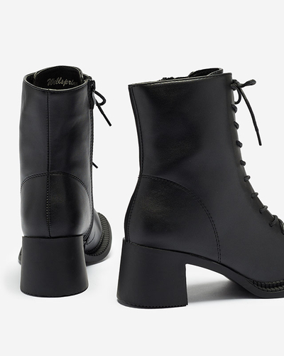 Dámské černé kozačky s kotníčkovými botami na sloupku Caretti. Obuv