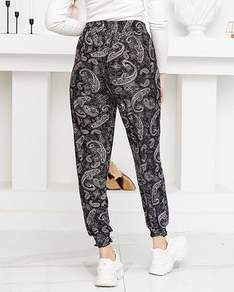 Dámské černé a bílé látkové kalhoty s potiskem - Oblečení