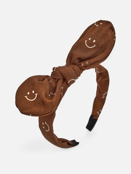 Royalfashion Дитяча пов'язка на волосся з бантиком з принтом у вигляді усміхнених облич