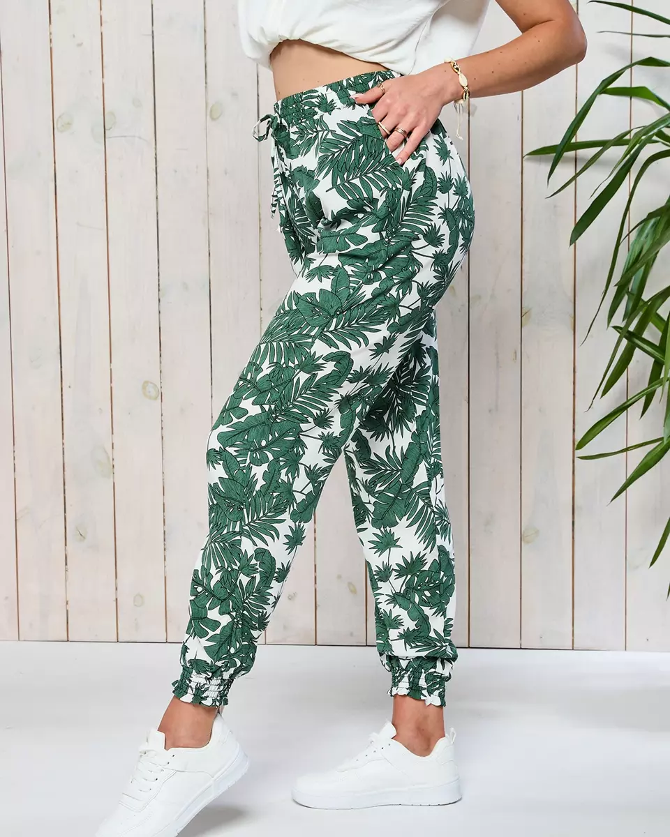 Зелені жіночі тканинні штани а-ля Алладін з квітковим візерунком - Одяг