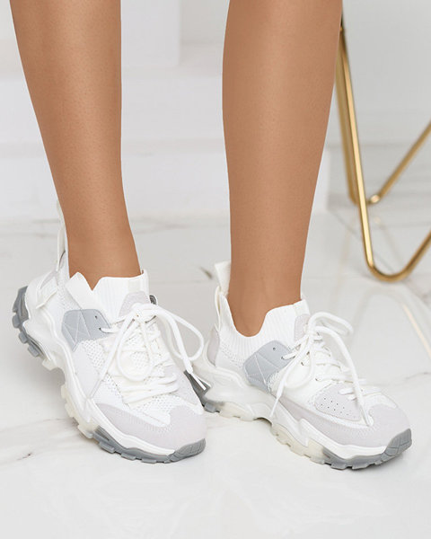 Біле жіноче спортивне взуття на масивній підошві Tiroka - Взуття