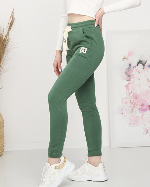 Зелені жіночі утеплені спортивні штани - Одяг